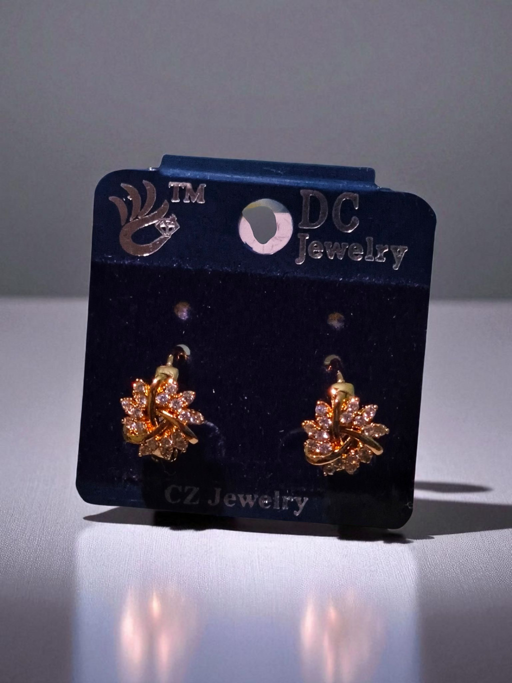 Elegant Leaf Earrings in Gold Finish with AD Engraving